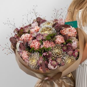 A close-up of the Classic Elegance brown bouquet, showing the mix of chrysanthemums and tulips.